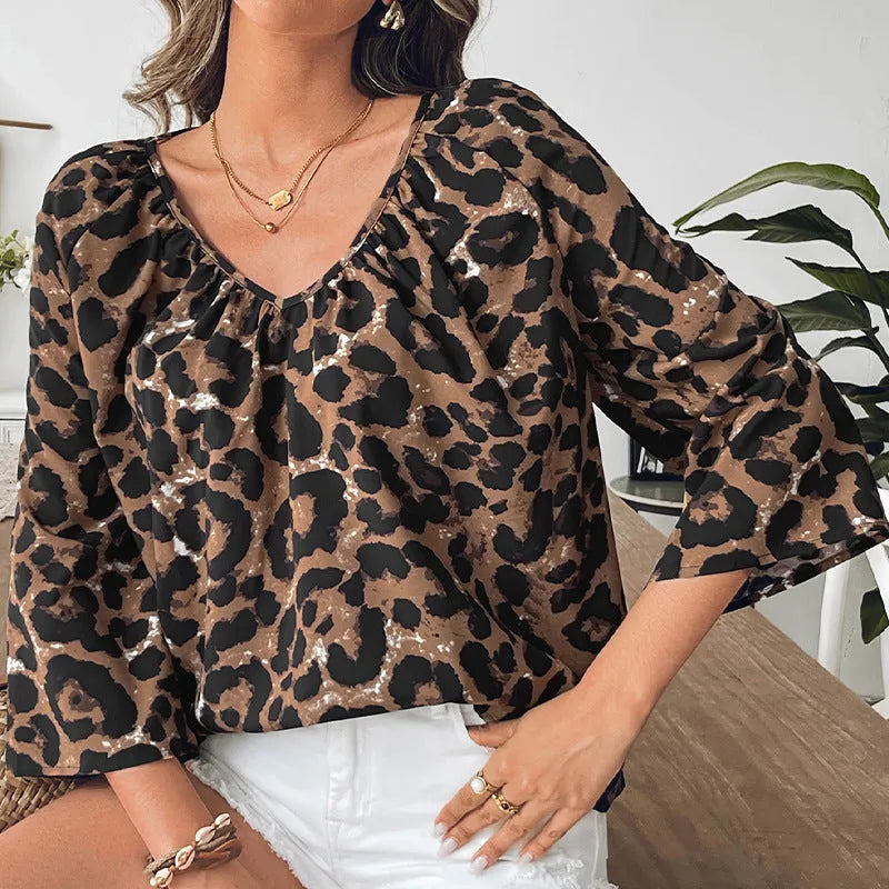 Women's leopard print V-neck half sleeve pullover top with pleated detailing