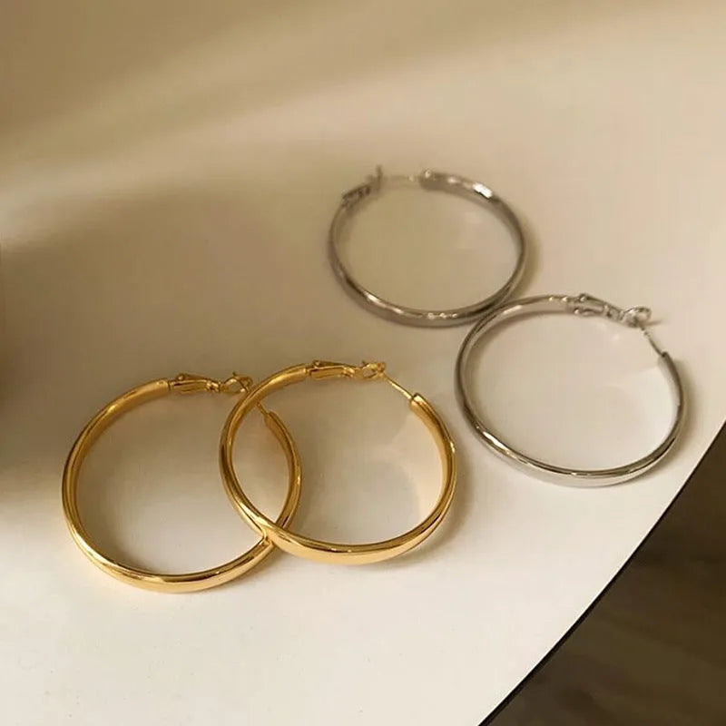 Copper circle earrings with 40mm diameter and electroplated gold or silver finish