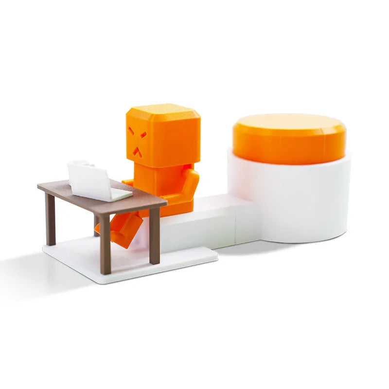 Orange plastic vent decompression toy on desk showing table turning mechanism