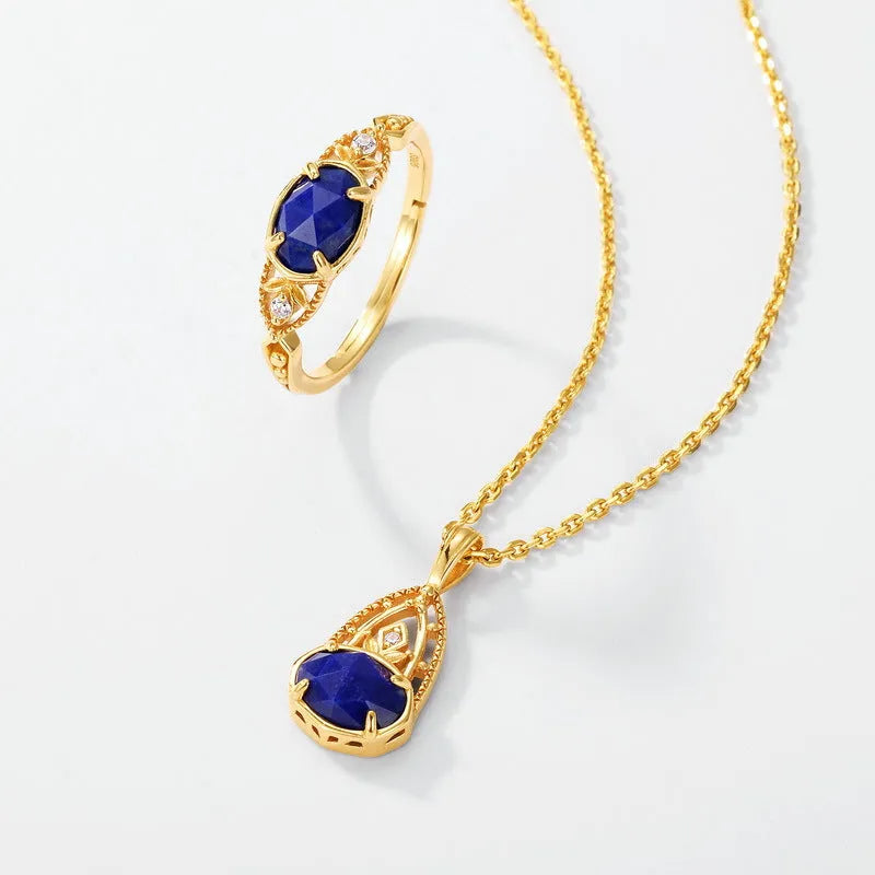 Silver ellipse ring with deep blue lapis lazuli stone in a geometric Japanese style design.