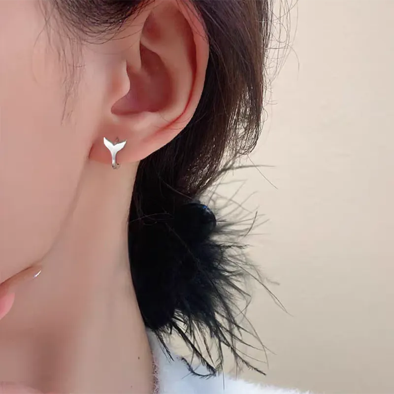 Women's fashion fishtail earrings in white gold and yellow gold colour options