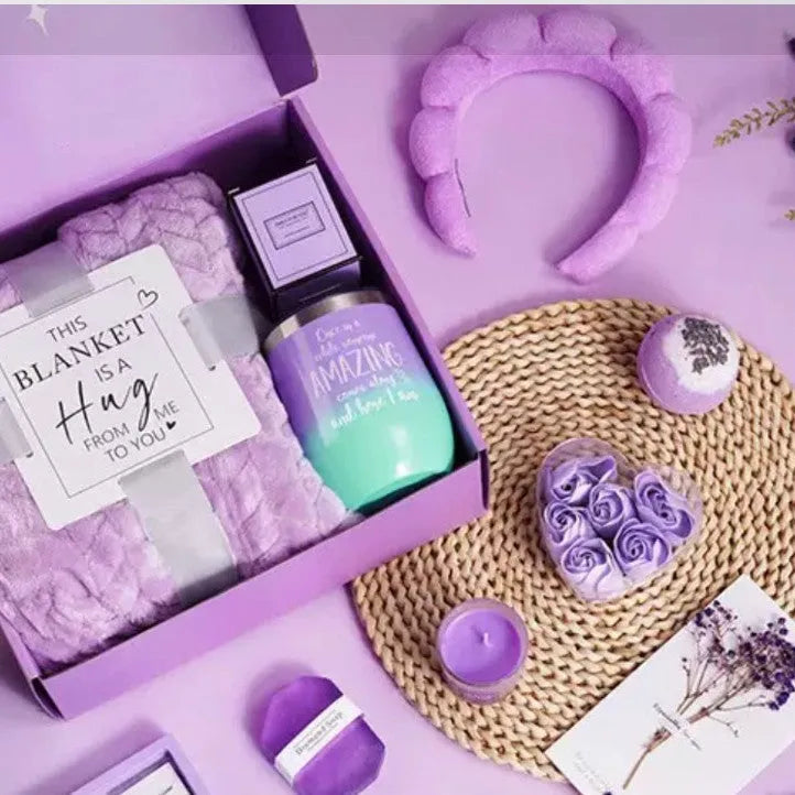 Aromatherapy gift box containing soy wax candles and bath products in modern simplicity design.