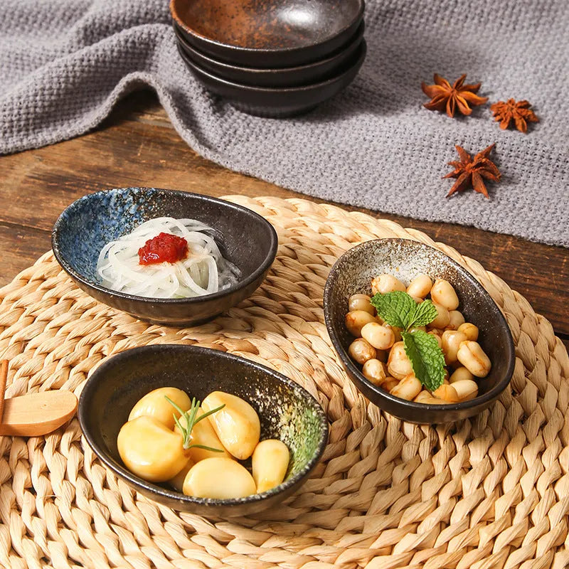 Japanese ceramic oval sauce dipping bowl with decorative pattern and underglaze finish