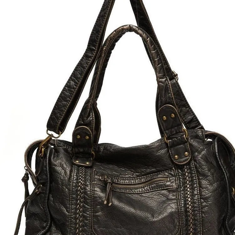 French retro women's motorcycle messenger bag in brown with weaving pattern detail and single shoulder strap