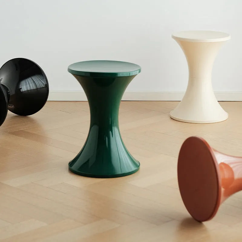 Hourglass-shaped plastic shoe changing stool with non-slip base in multiple colour options