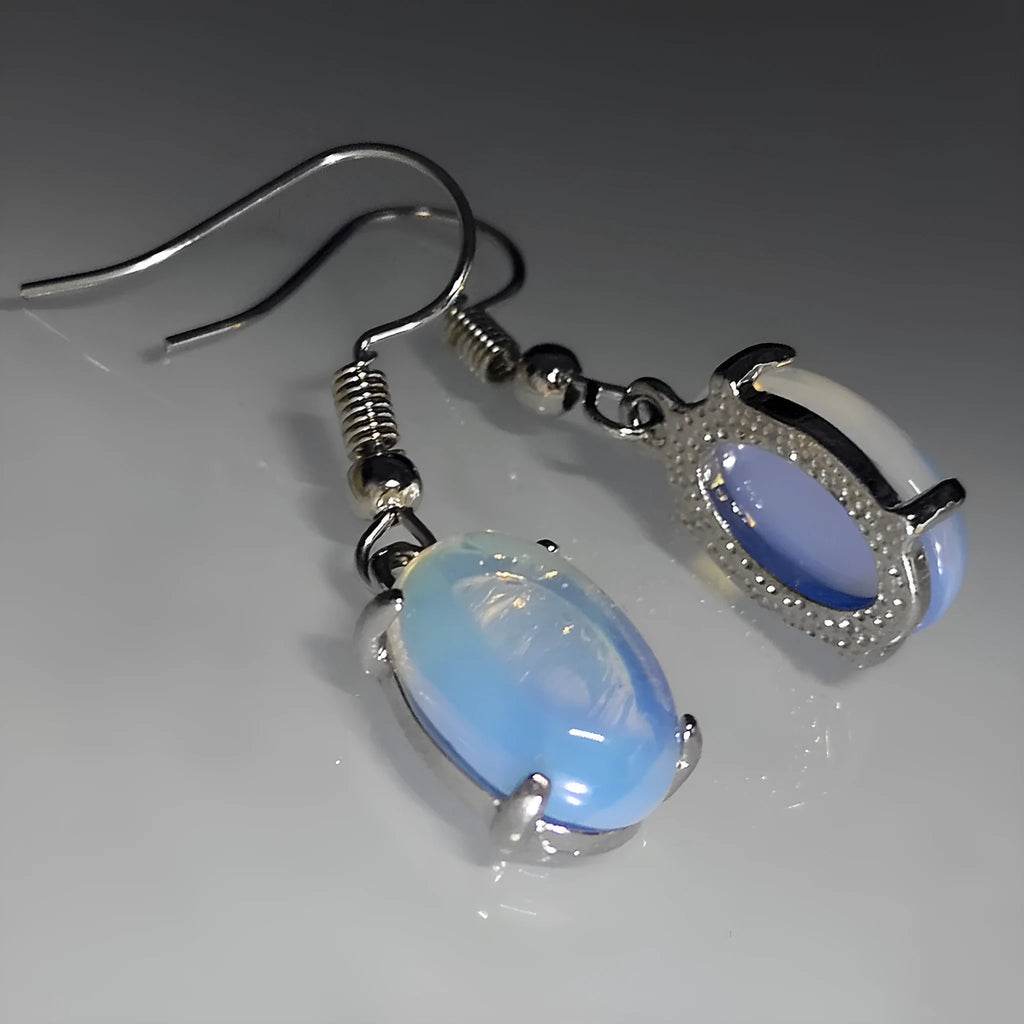 Moonlight white opal earrings with retro moonstone cross design and drop shape