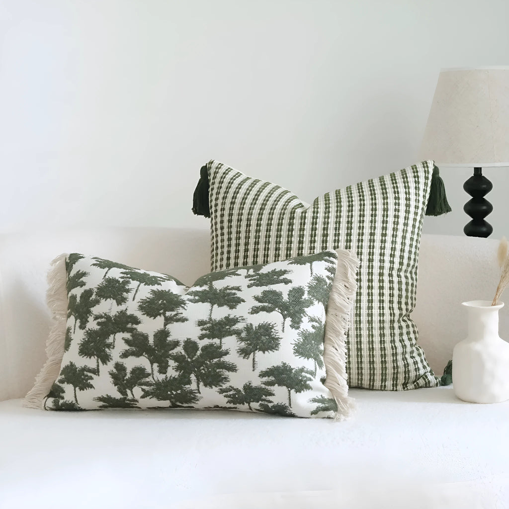 Green cotton and linen hotel sample pillow with botanical pattern and tassel trim, shown with separate pillow core.
