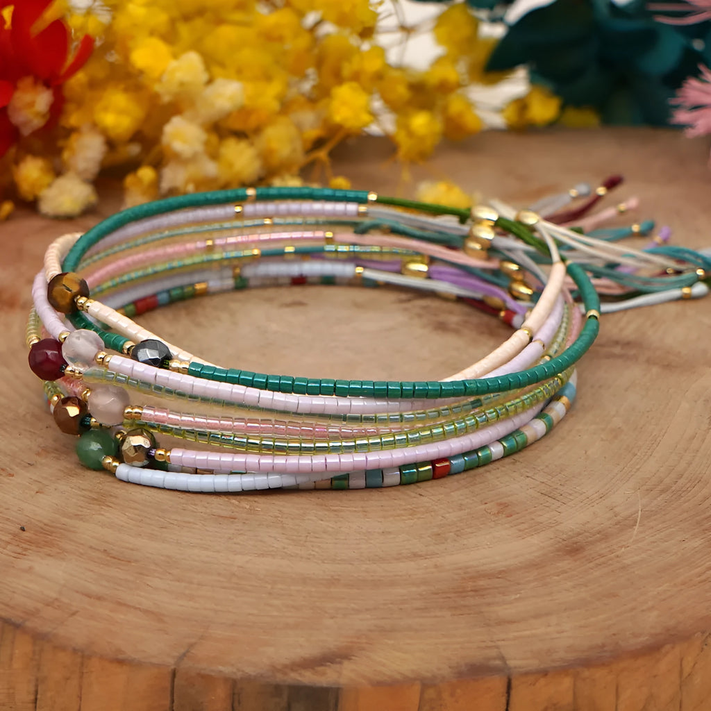 Women's colourful bohemian style beaded bracelet with geometric shaped glass and coloured glaze beads