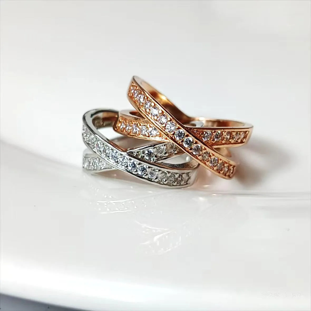 Metal cross ring with micro-inlaid zircon stones in silver and rose gold options