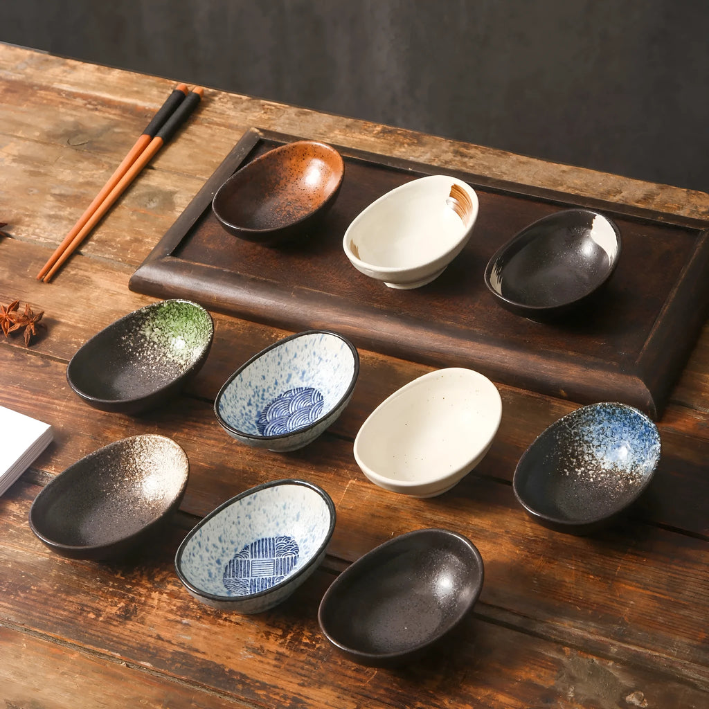 Japanese ceramic oval sauce dipping bowl with decorative pattern and underglaze finish