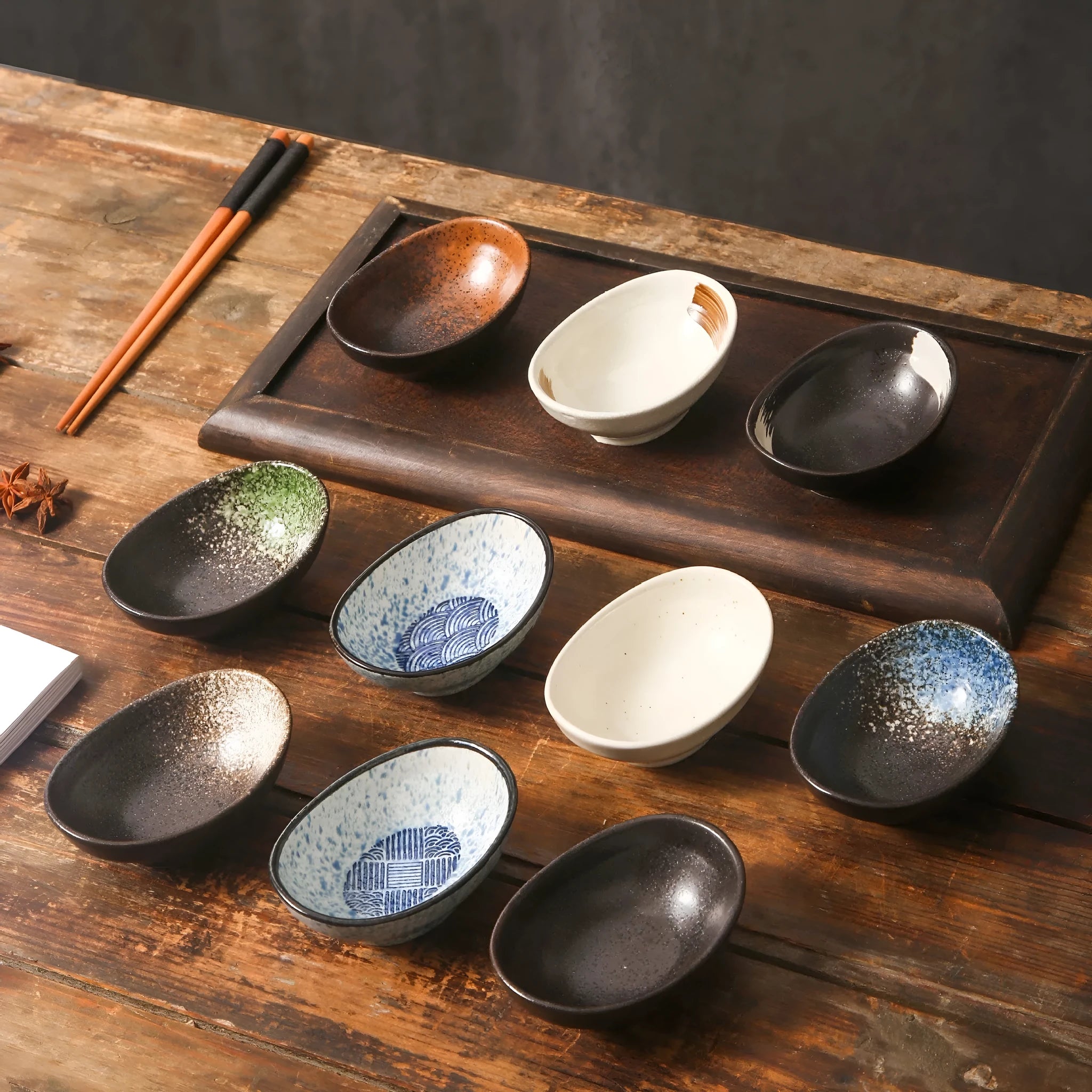 Japanese ceramic oval sauce dipping bowl with decorative pattern and underglaze finish