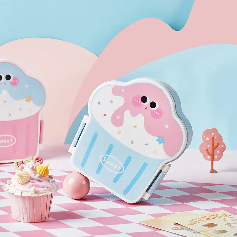 Pink and blue creative ice cream shaped plastic lunch box with bento compartments, spoon, and fork.