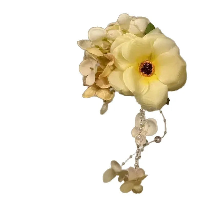 Yellow and purple floral tassel side hair clip for women on holiday style.