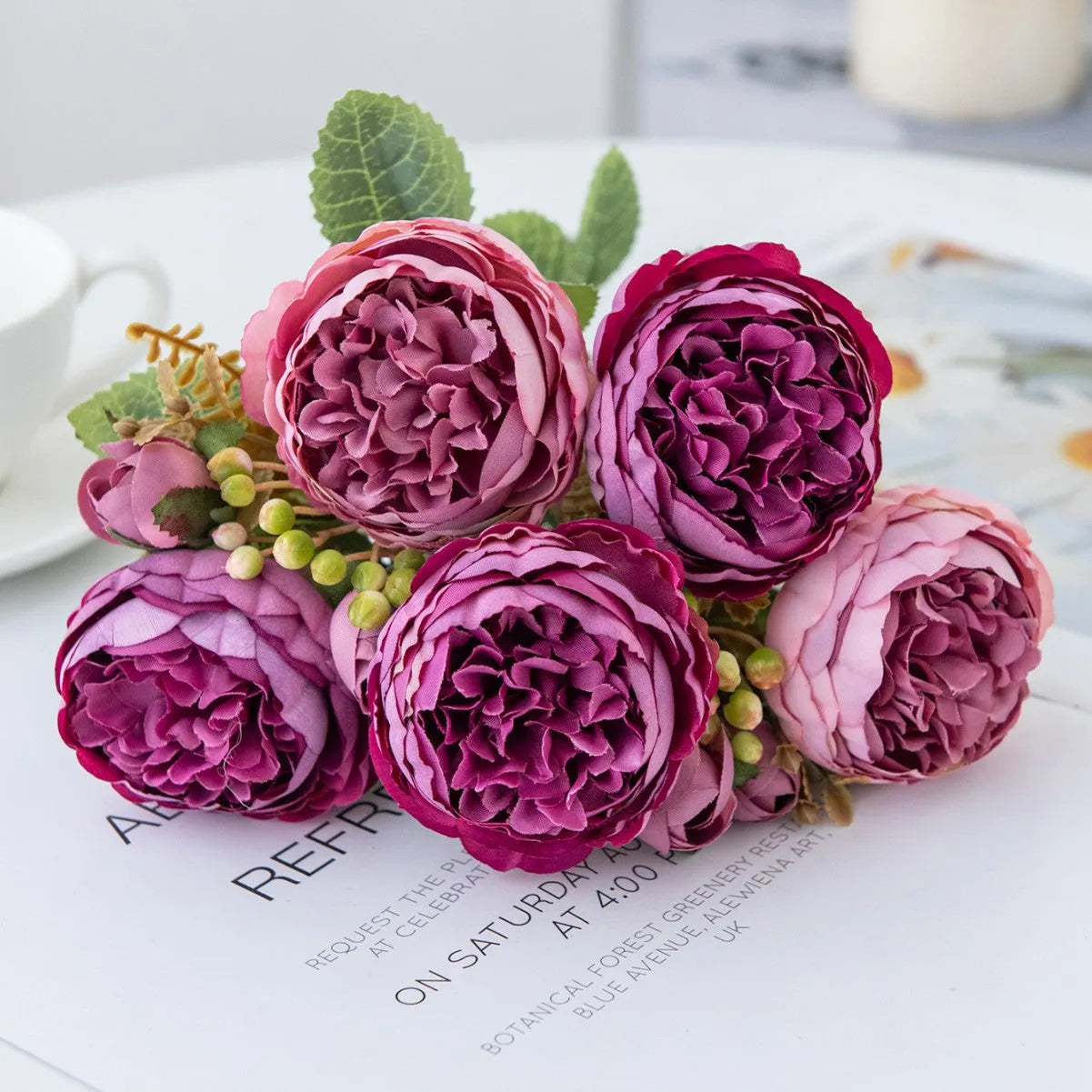 Artificial silk peony bouquet in a champagne colour for home or wedding decoration.