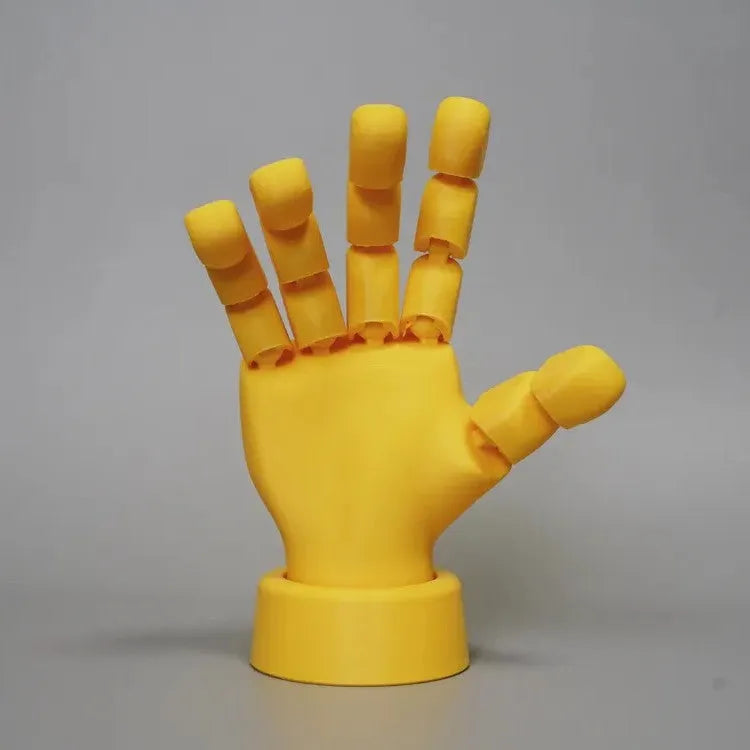 Yellow PLA movable joint hand props ornament with articulated fingers on white background