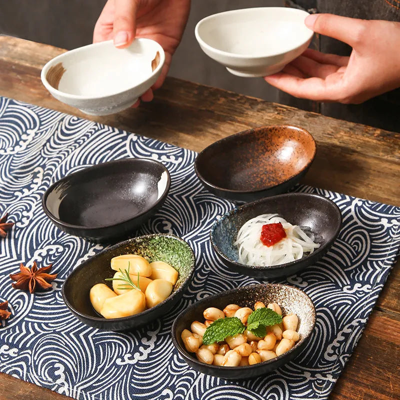 Japanese ceramic oval sauce dipping bowl with decorative pattern and underglaze finish