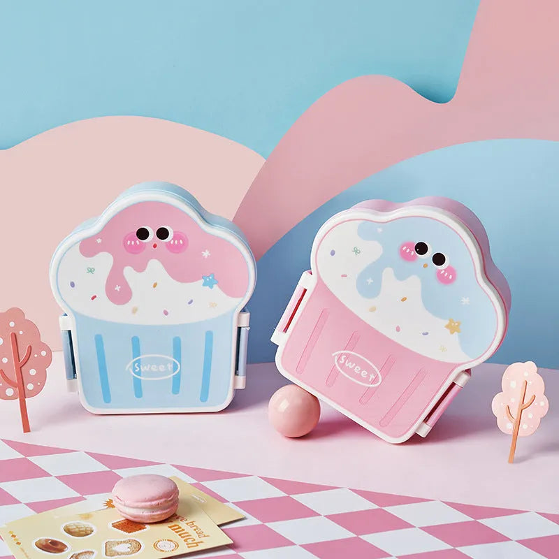 Pink and blue creative ice cream shaped plastic lunch box with bento compartments, spoon, and fork.