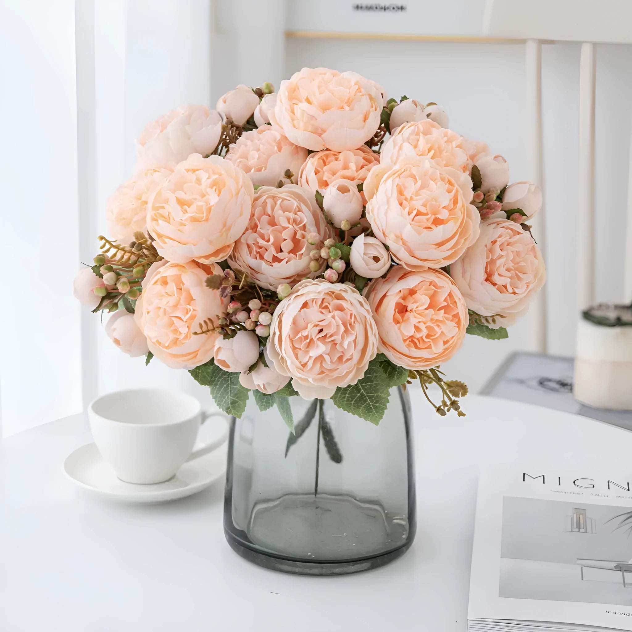 Artificial silk peony bouquet in a champagne colour for home or wedding decoration.