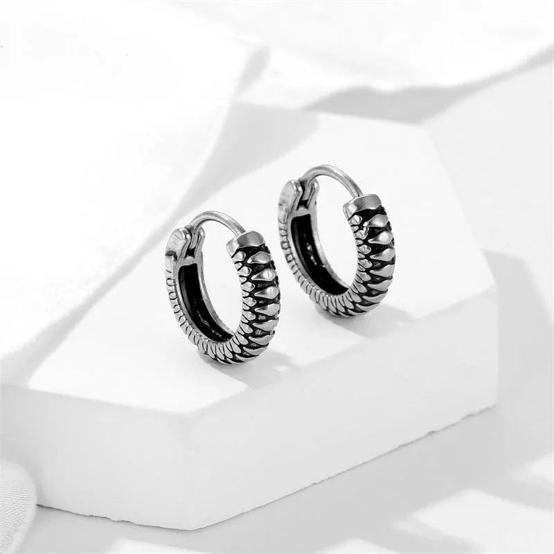 Silver geometric twist earrings with striped pattern on stainless steel