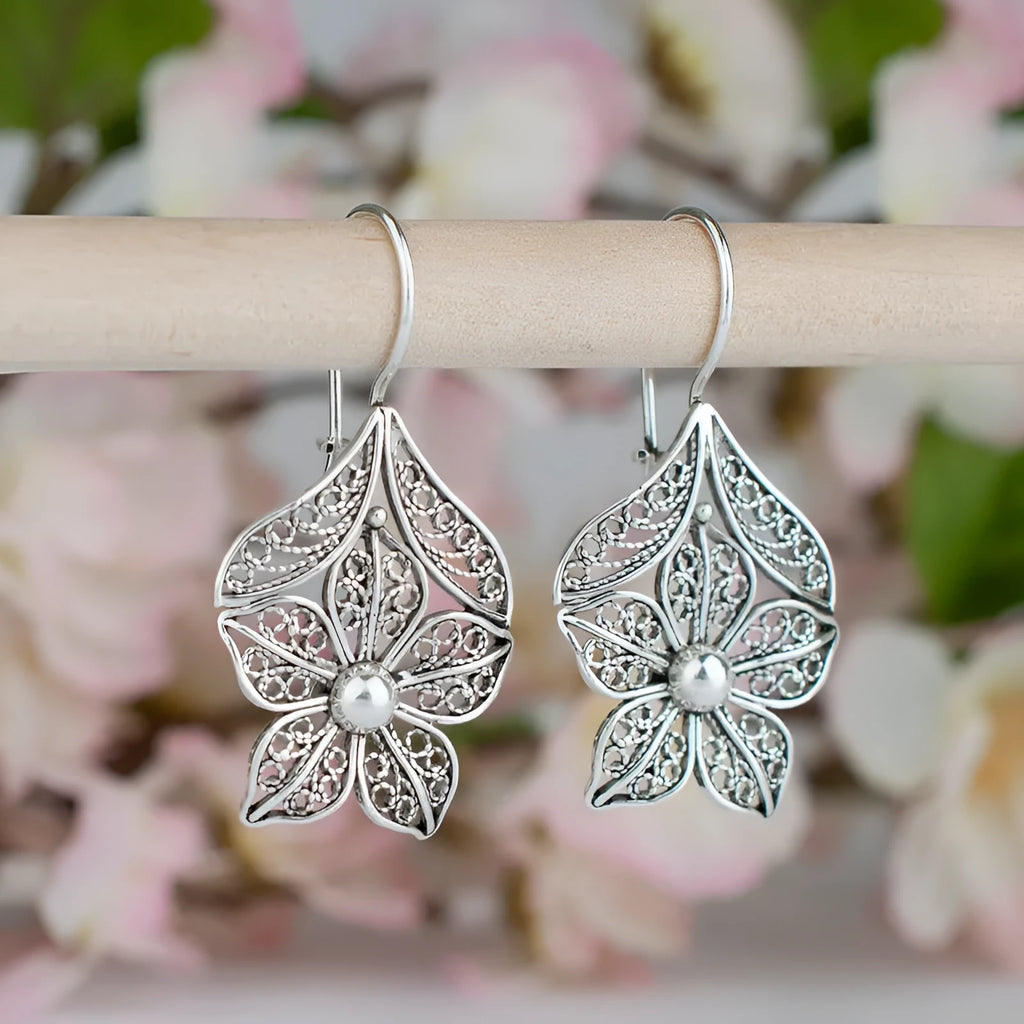 Silver alloy hollow flower leaf-shaped earrings for women retro simple style