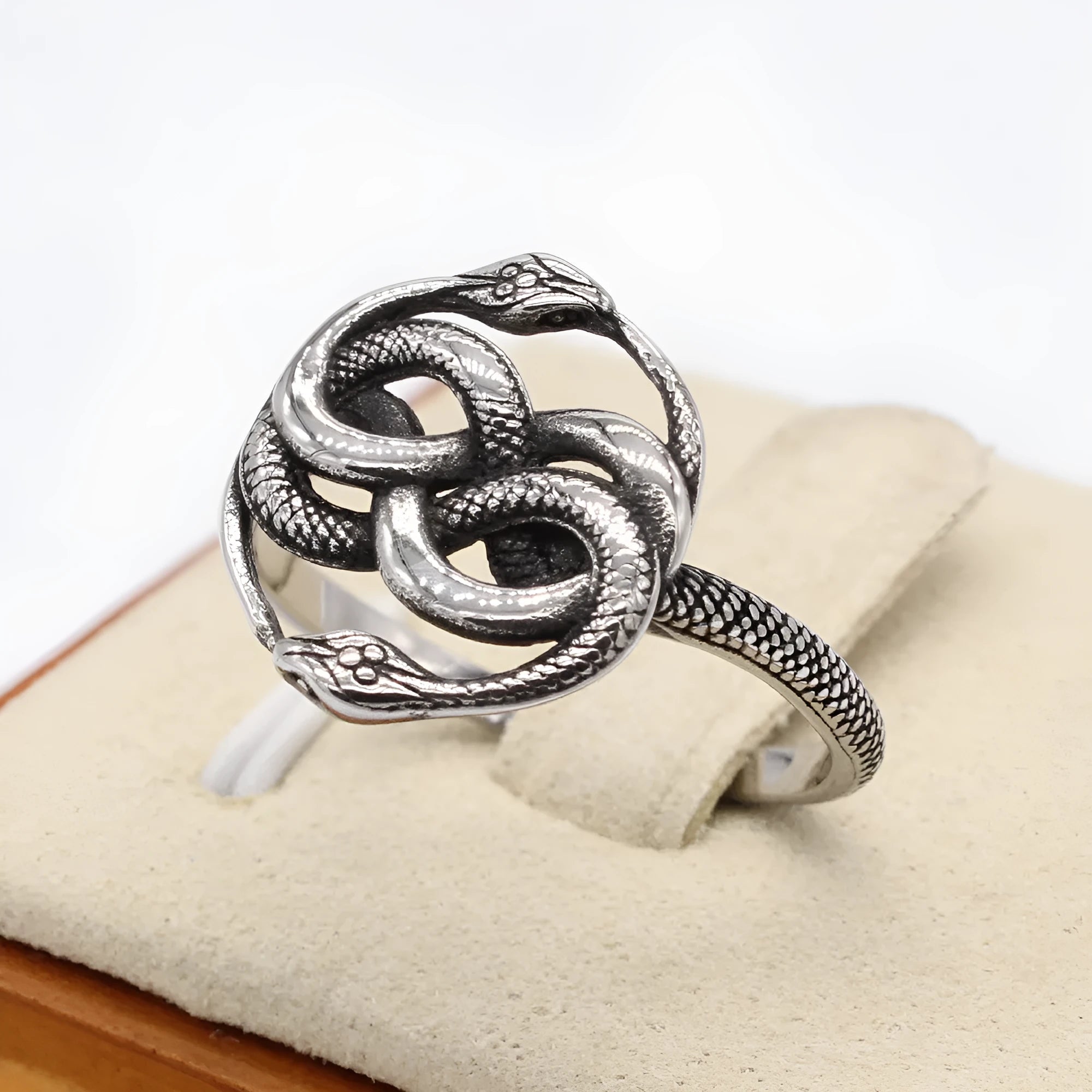 Titanium steel double snake retro ring in steel colour showing detailed snake motif design