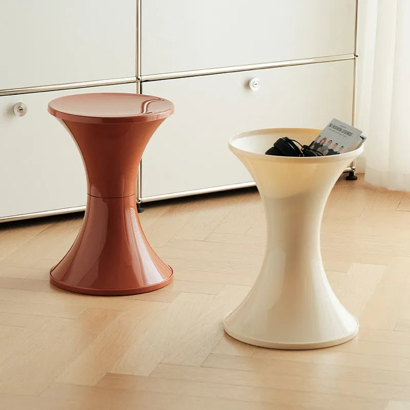 Hourglass-shaped plastic shoe changing stool with non-slip base in multiple colour options