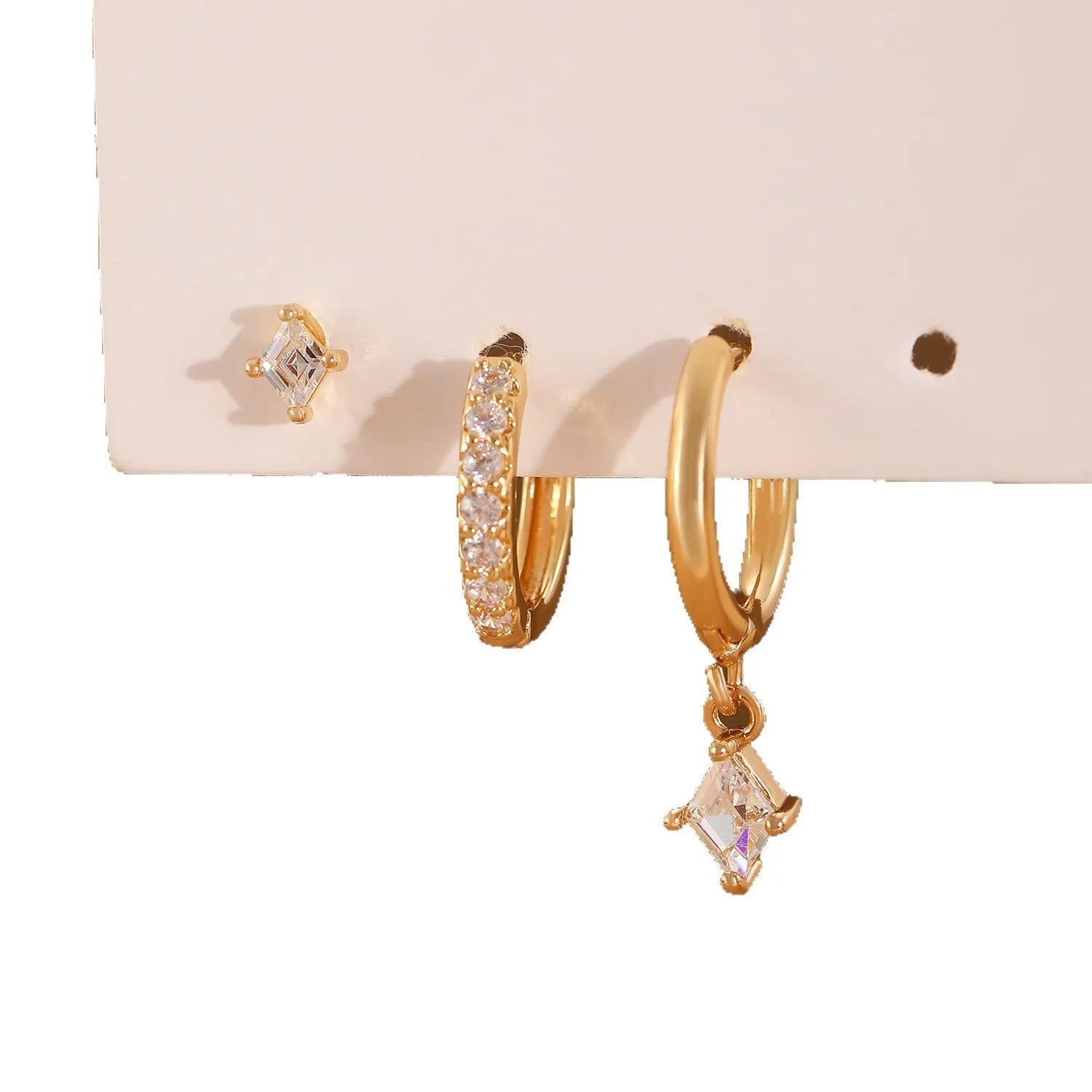 Ladies three-piece earring set with geometric designs and inlaid zircon stones in gold or white finish