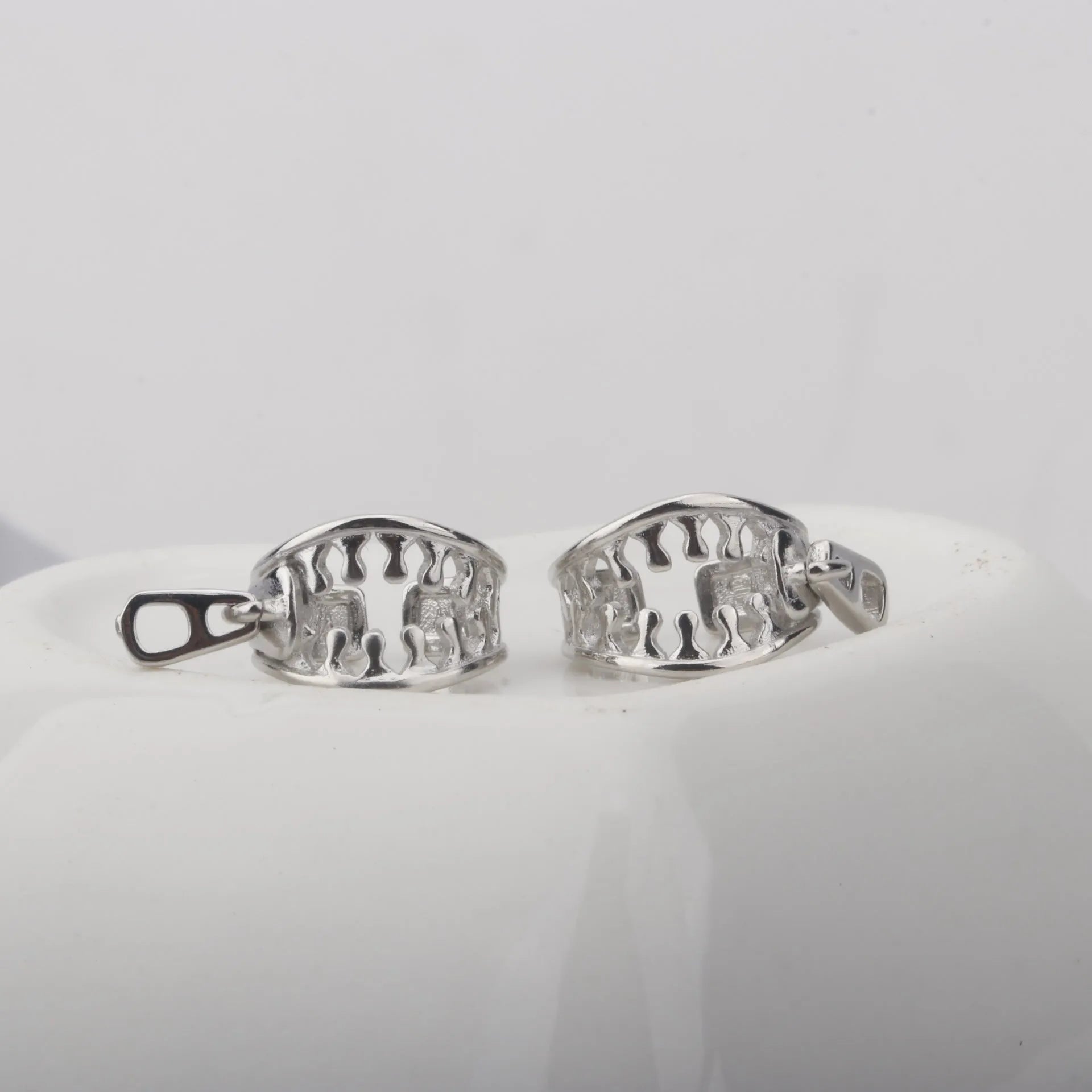A pair of geometric copper clip-on earrings with a simple line design, colour ES862.