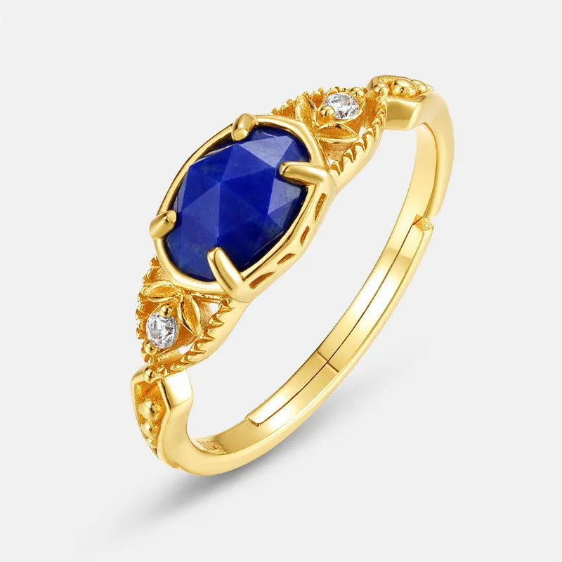 Silver ellipse ring with deep blue lapis lazuli stone in a geometric Japanese style design.