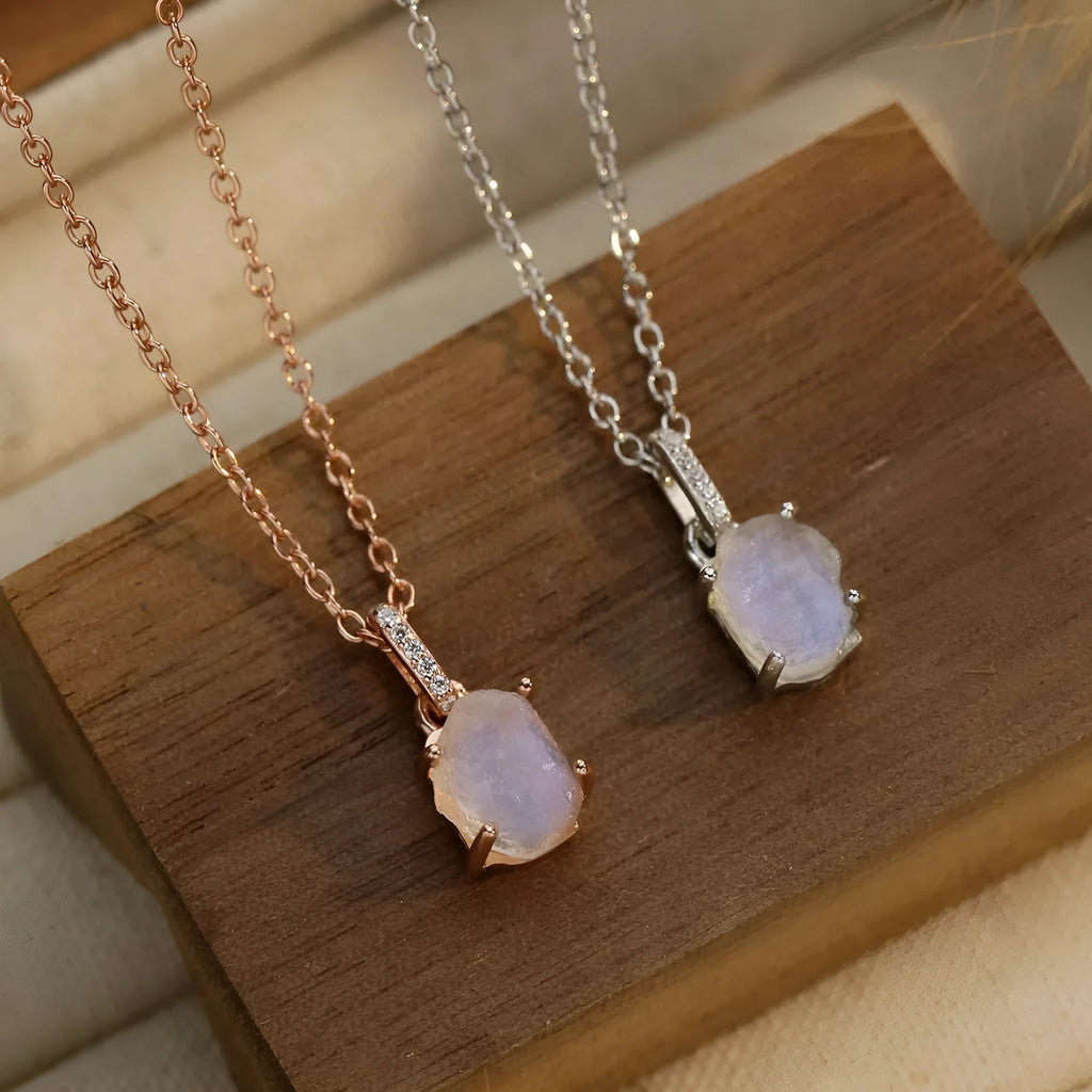 S925 sterling silver geometric moonstone pendant necklace with curb chain on white background