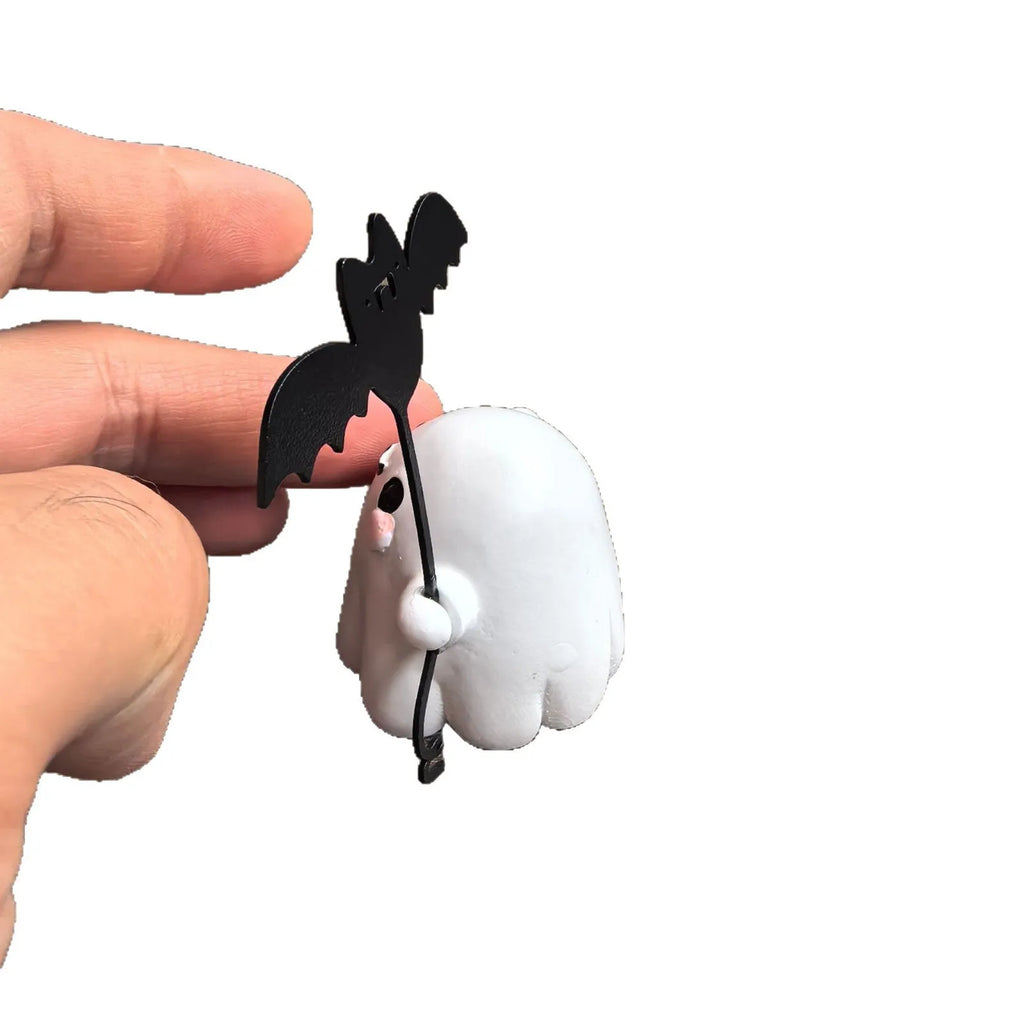 Mini resin ghost dog statue holding a bat, a Halloween decoration measuring 4cm.