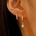 Ladies three-piece earring set with geometric designs and inlaid zircon stones in gold or white finish