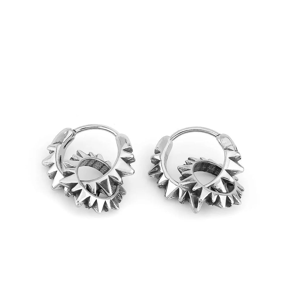 A pair of polished stainless steel round hoop earrings in a steel colour with a simple, retro design.