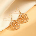 Women's spiral donut jewellery set showing matching gold necklace, bracelet, and earrings with geometric circle design