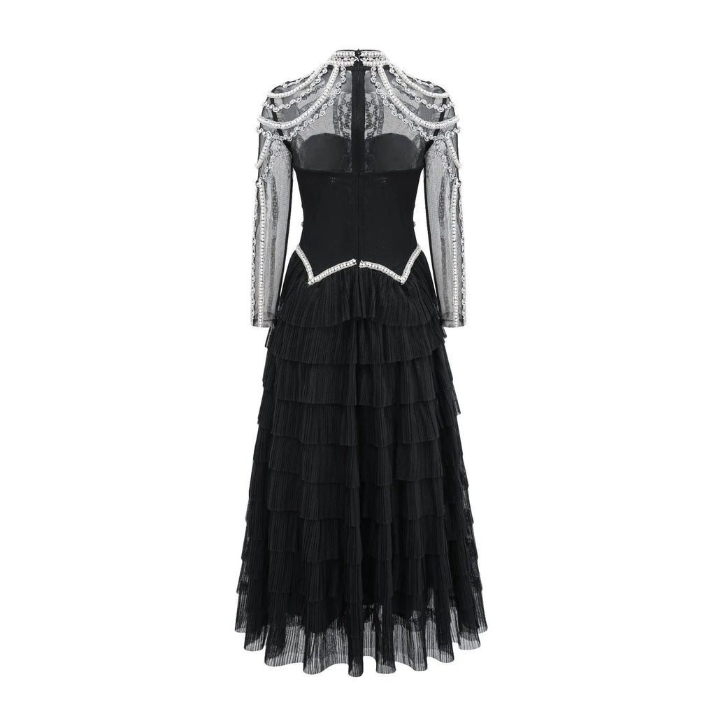 Women's black long sleeve dress with beaded decoration and mid waist silhouette
