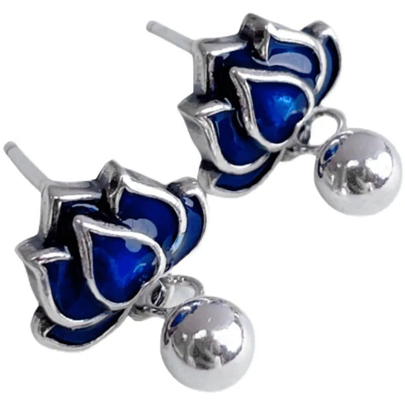 Women's lotus seedpod earrings with tassel accents in silver needle alloy