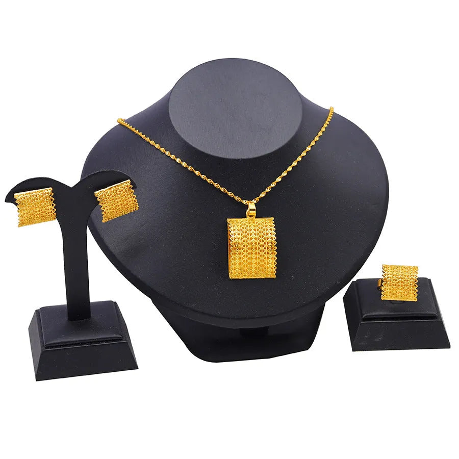 Women's bridal wedding gold jewelry set including copper necklace, earrings, and ring in natural style golden finish