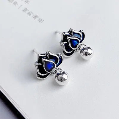 Women's lotus seedpod earrings with tassel accents in silver needle alloy