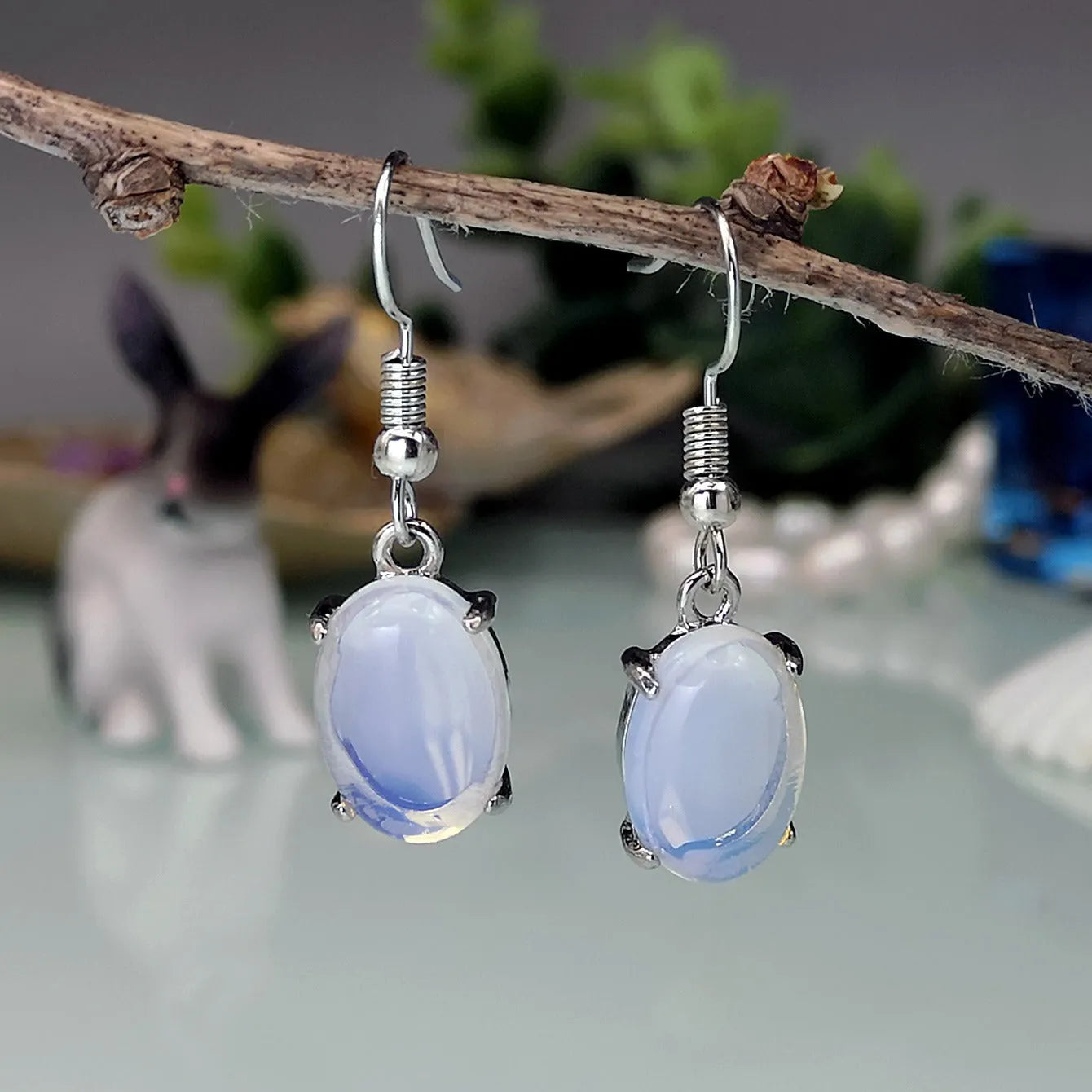 Moonlight white opal earrings with retro moonstone cross design and drop shape