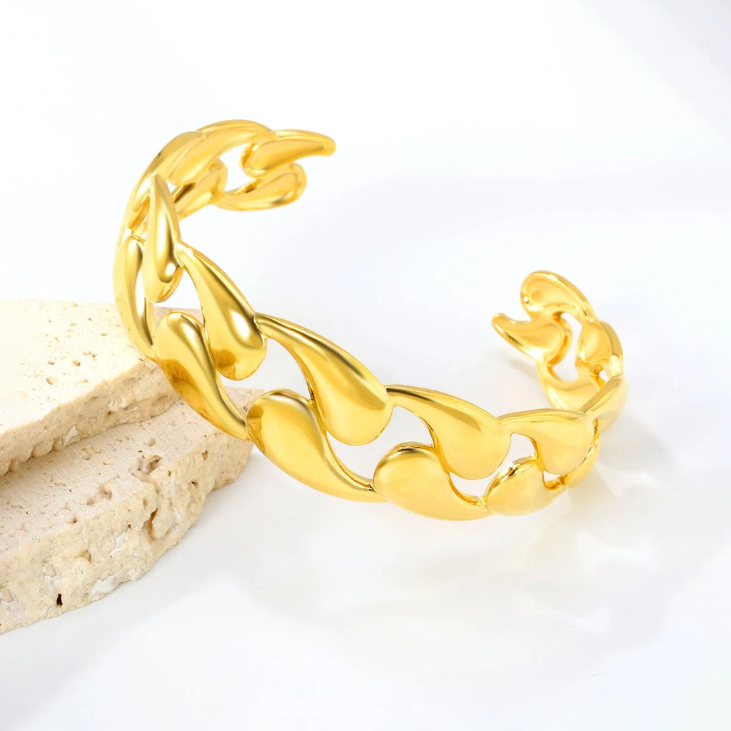 Contemporary stainless steel and alloy bracelet in European-American style on a wrist.