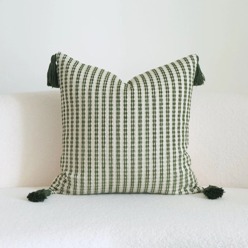 Green cotton and linen hotel sample pillow with botanical pattern and tassel trim, shown with separate pillow core.