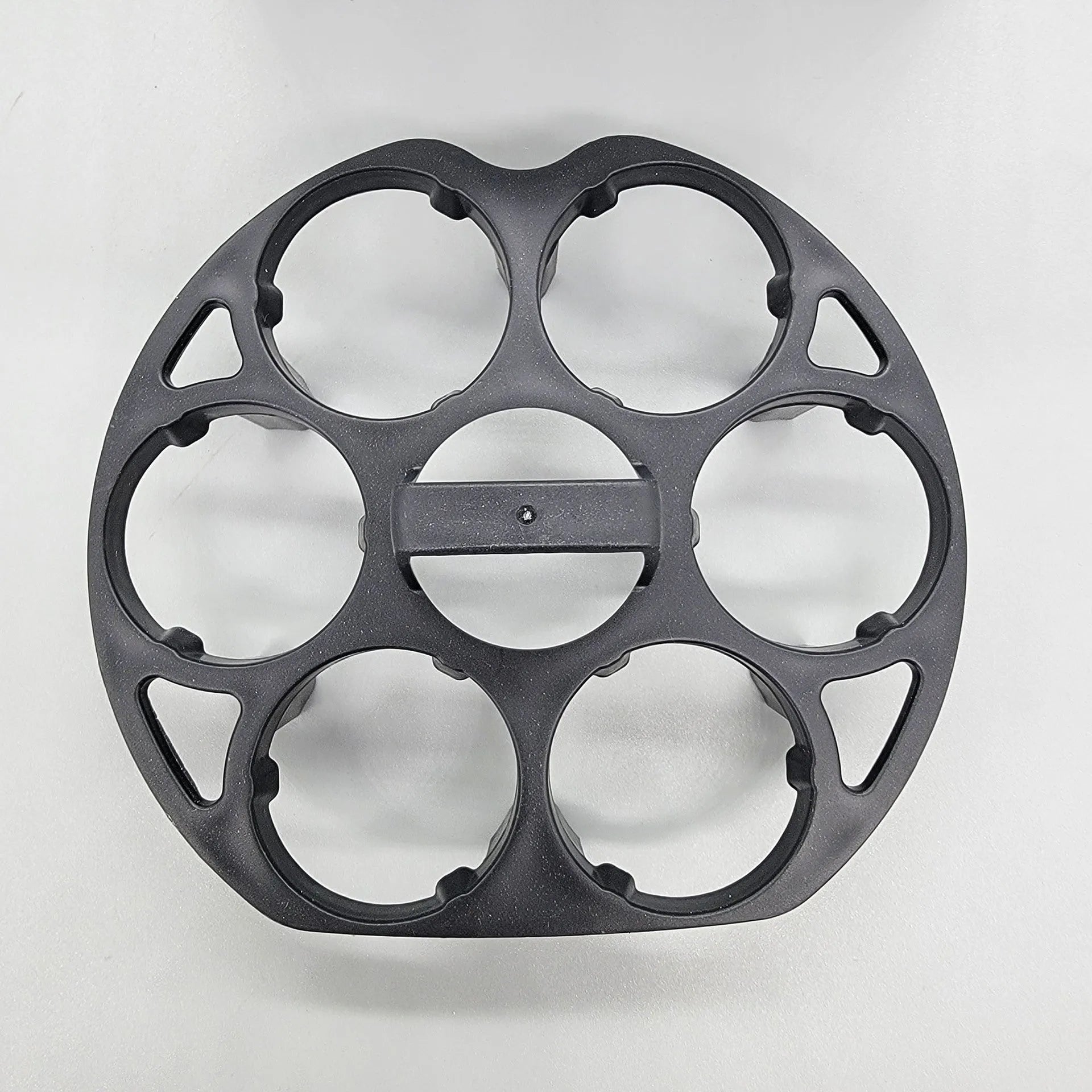 Black plastic egg storage rack with modern design on a kitchen counter