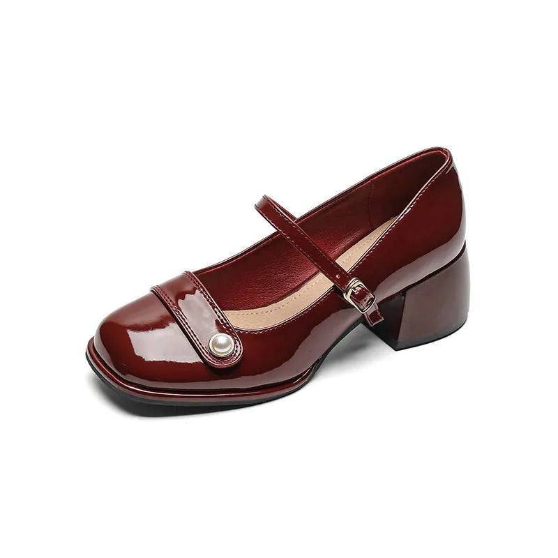 Plus size patent leather pumps with chunky block heels in apricot colour, showing square toe design and buckle fastening