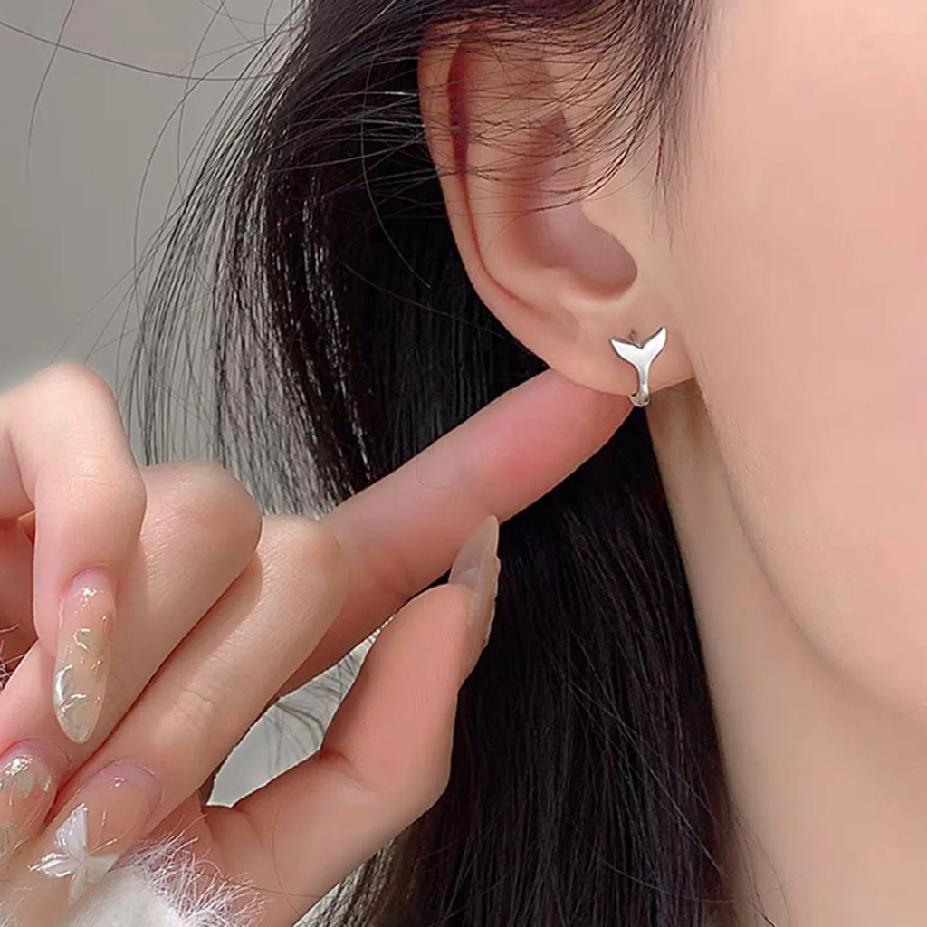 Women's fashion fishtail earrings in white gold and yellow gold colour options
