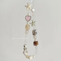 Island Sweetheart bohemian beaded alloy mobile phone charm on pastel background