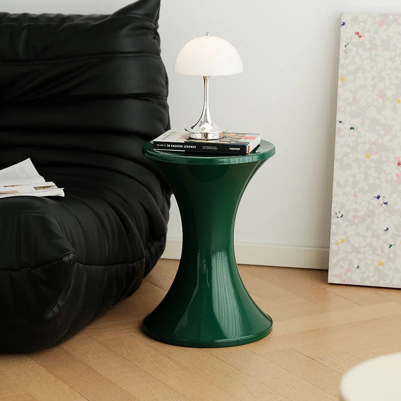 Hourglass-shaped plastic shoe changing stool with non-slip base in multiple colour options