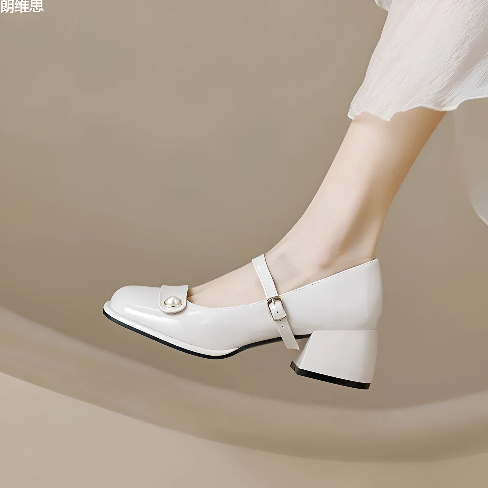 Plus size patent leather pumps with chunky block heels in apricot colour, showing square toe design and buckle fastening