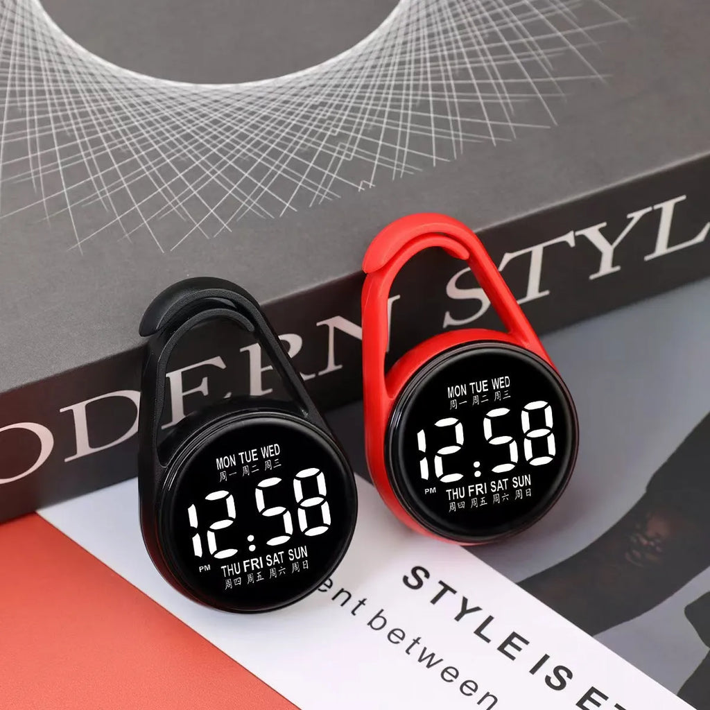 Mini digital electronic watch with luminous week display on a plastic strap, shown in multiple colour options.