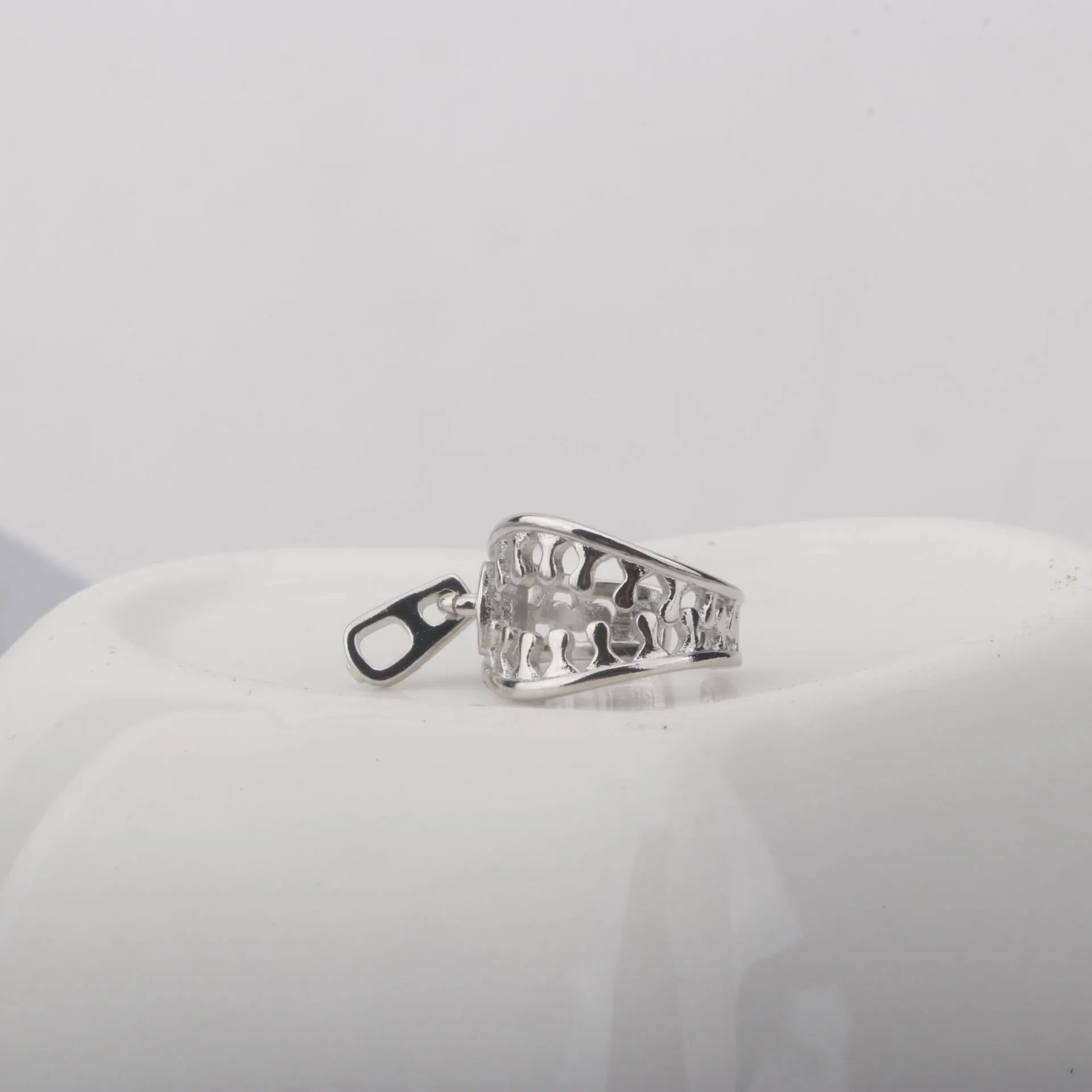 A pair of geometric copper clip-on earrings with a simple line design, colour ES862.