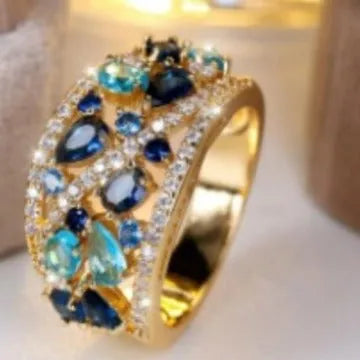 Women's round hollow fashion ring in copper with gemstone options, showing the openwork design.